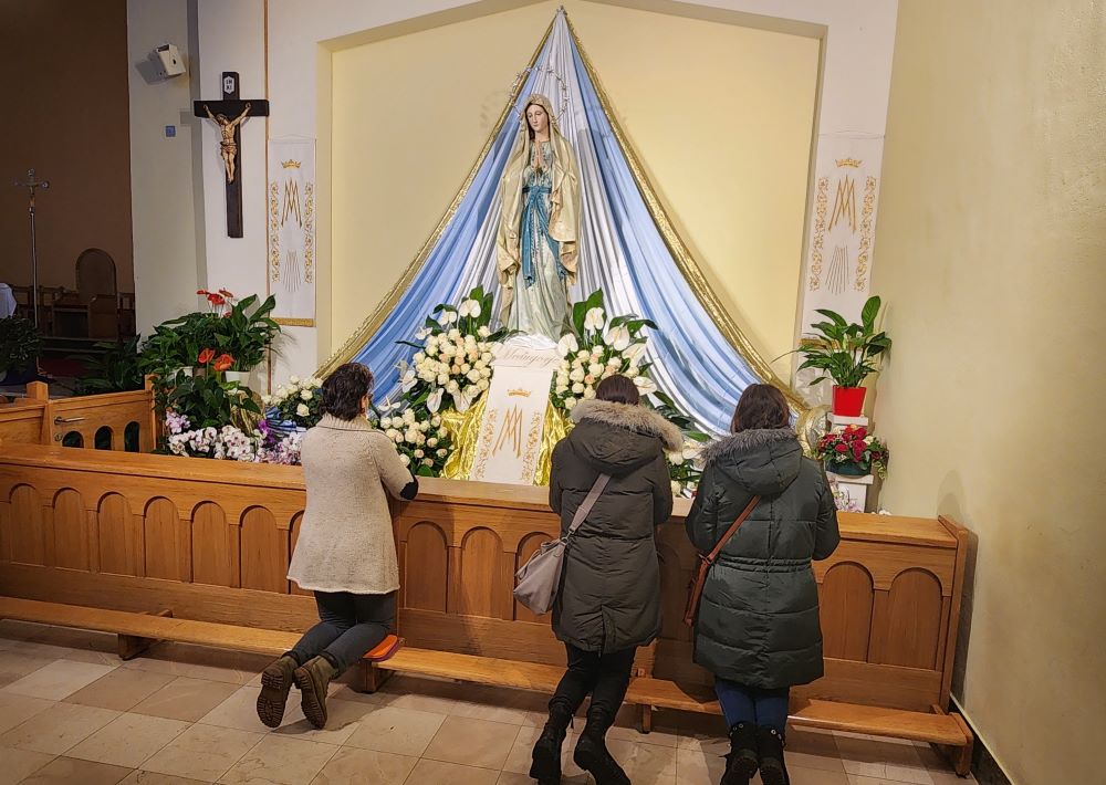 Pilgrims to the Marian shrine in Medjugorje, Bosnia and Herzegovina, pray at the Church of St. James.