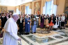 Pope Francis arrives for a meeting with women participating in or assisting the Synod of Bishops in the Apostolic Palace at the Vatican Oct. 19, 2024. The synod on synodality, for the first time in history, lay people, including about 50 women, were included as voting members. (CNS/Vatican Media)