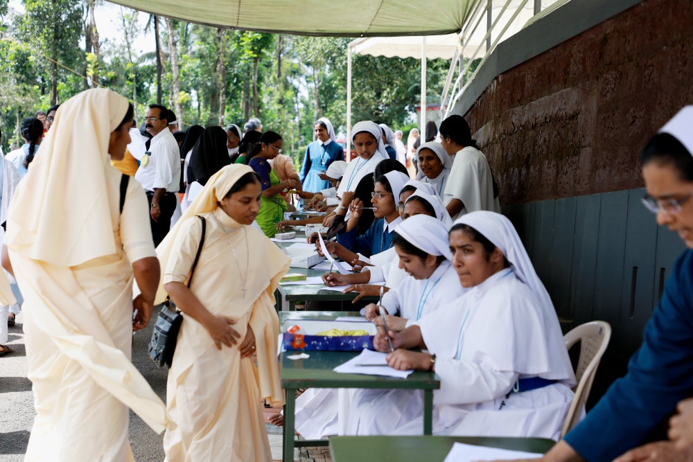 Catholic nuns register their names for a prayer gathering to address negative media coverage of religious life on Sept. 15 at the Pastoral Centre of Dwaraka parish in Kerala, India. (Saji Thomas) Catholic nuns register their names for a prayer gathering to address negative media coverage of religious life on Sept. 15 at the Pastoral Centre of Dwaraka parish in Kerala, India. (Saji Thomas)