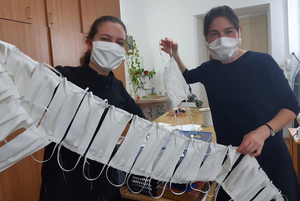 Candidates of Sisters of Mercy of the Holy Cross in Djakovo, Croatia, show a string of masks they have sewn to share with the people in the communities they serve. (Sr. Valerija Široki) Candidates of Sisters of Mercy of the Holy Cross in Djakovo, Croatia, show a string of masks they have sewn to share with the people in the communities they serve. (Sr. Valerija Široki)