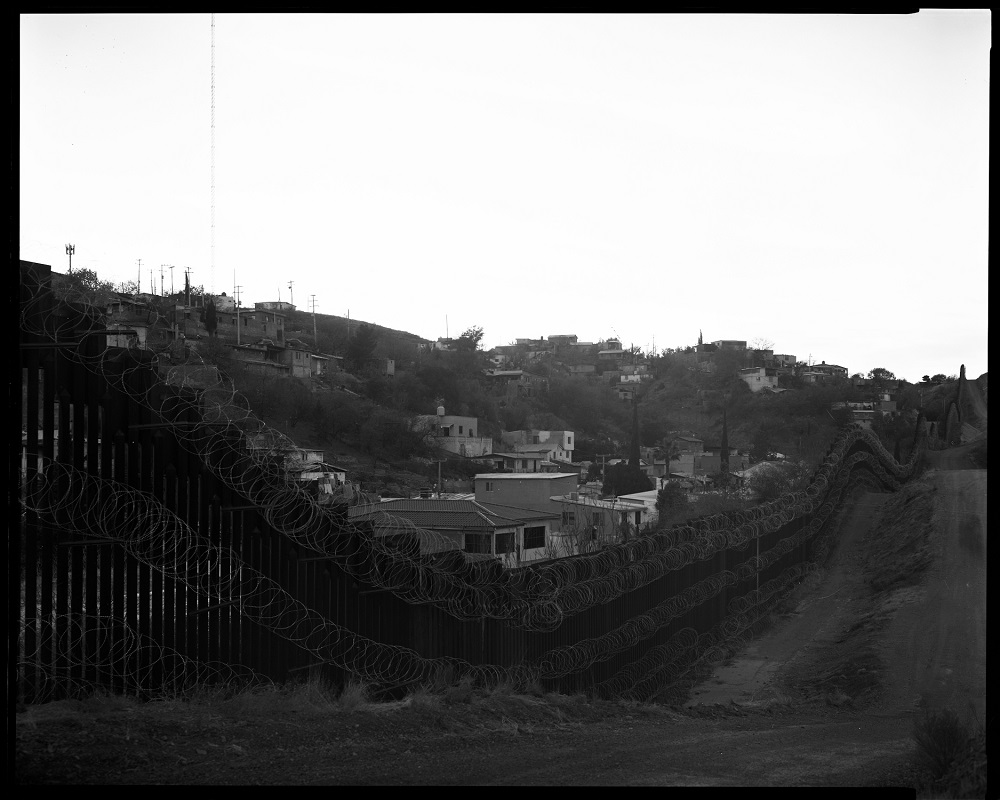 The community of Nogales, Mexico, as seen over the Arizona border fence in January. The city utilizes every inch of its side of the wall. (© Lisa Elmaleh) The community of Nogales, Mexico, as seen over the Arizona border fence in January. The city utilizes every inch of its side of the wall. (© Lisa Elmaleh)