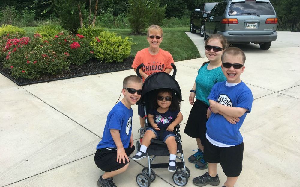 Robin Worley, in the orange shirt, with her four children, Teagan, Heidi and identical twins Micah and Noah. Robin Worley, in the orange shirt, with her four children, Teagan, Heidi and identical twins Micah and Noah.