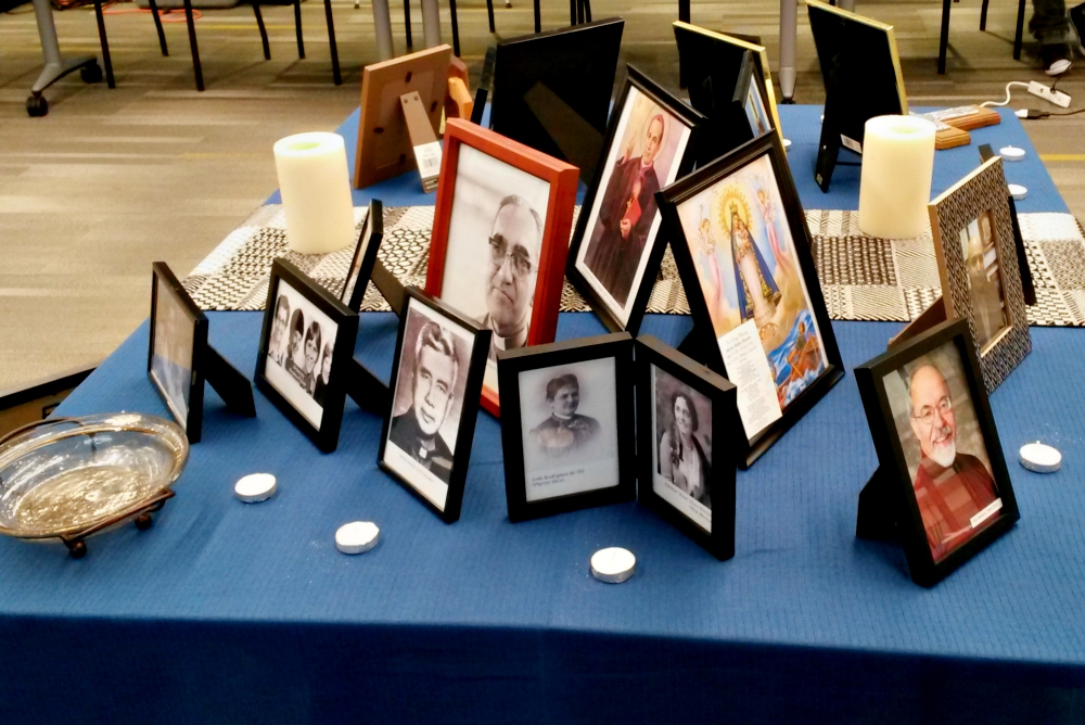 An ofrenda set up at the 2019 ACHTUS Colloquium at the University of Dayton, Ohio, June 2-5 displays photos of deceased ACHTUS members, loved ones and others. (NCR photo/Maria Benevento) An ofrenda set up at the 2019 ACHTUS Colloquium at the University of Dayton, Ohio, June 2-5 displays photos of deceased ACHTUS members, loved ones and others. (NCR photo/Maria Benevento)