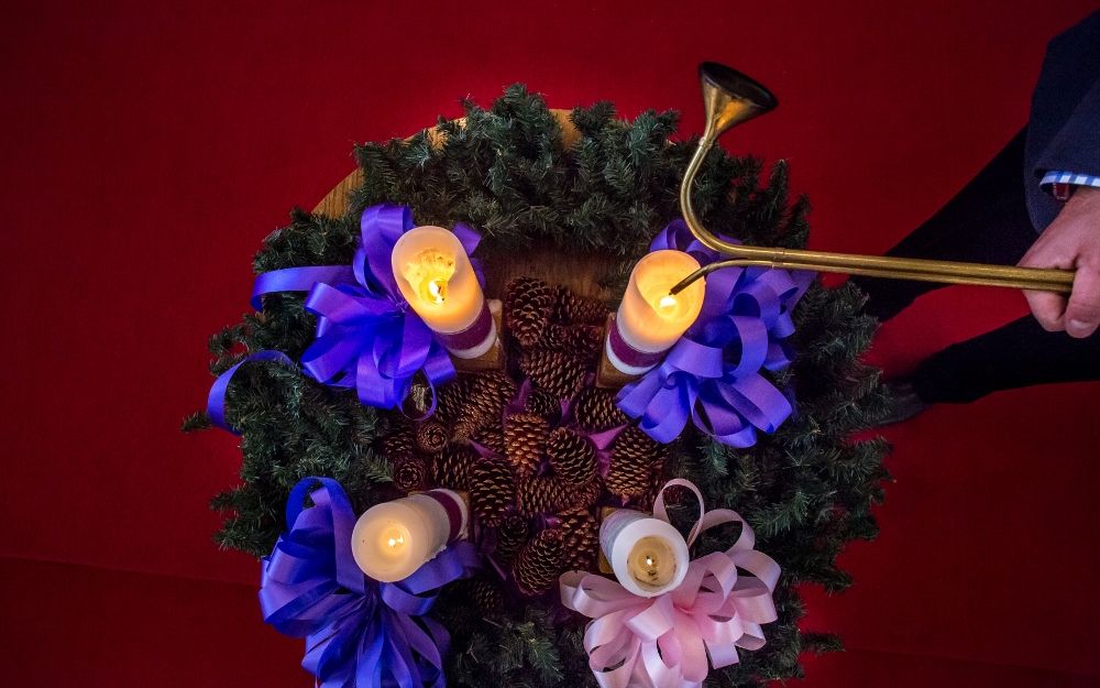 A man lights a candle on the Advent wreath at St. Raphael the Archangel Church in St. Louis in 2015.  A man lights a candle on the Advent wreath at St. Raphael the Archangel Church in St. Louis in 2015.