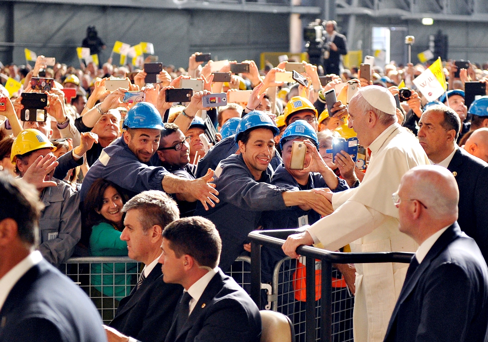 Pope Francis greets workers as he arrives at the ILVA steel plant during a May 2017 pastoral visit in Genoa, Italy. (CNS/Reuters/Giorgio Perottino) Pope Francis greets workers as he arrives at the ILVA steel plant during a May 2017 pastoral visit in Genoa, Italy. (CNS/Reuters/Giorgio Perottino)