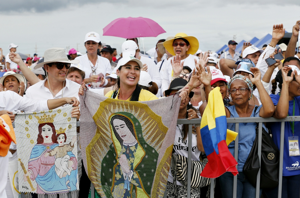 People celebrate as Pope Francis celebrates Mass at Contecar terminal in Cartagena, Colombia, Sept. 10. (CNS/Paul Haring) People celebrate as Pope Francis celebrates Mass at Contecar terminal in Cartagena, Colombia, Sept. 10. (CNS/Paul Haring)