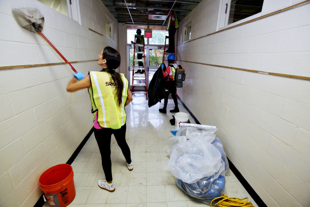 Restoration workers clean a hallway inside St. Mary School Sept. 28 in Wilmington, North Carolina, which sustained significant damage from Hurricane Florence. (CNS/Bob Roller) Restoration workers clean a hallway inside St. Mary School Sept. 28 in Wilmington, North Carolina, which sustained significant damage from Hurricane Florence. (CNS/Bob Roller)