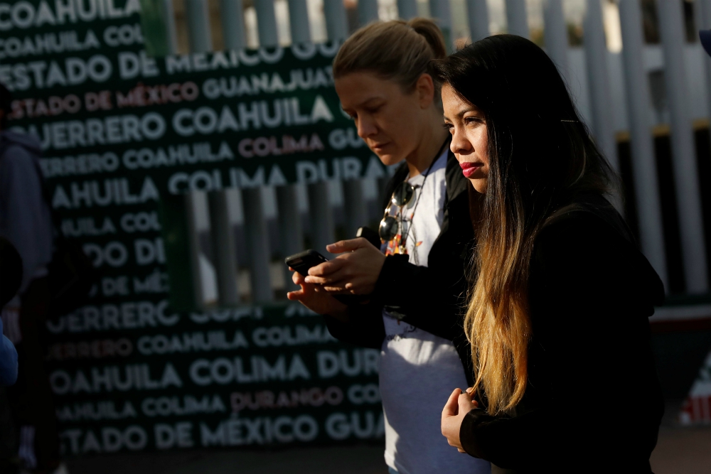 A woman waits for her number to seek asylum in the United States at the Chaparral border crossing in Tijuana, Mexico, Jan. 28. (CNS/Reuters/Shannon Stapleton) A woman waits for her number to seek asylum in the United States at the Chaparral border crossing in Tijuana, Mexico, Jan. 28. (CNS/Reuters/Shannon Stapleton)