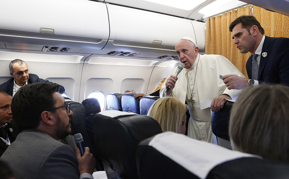 Pope Francis responds to a question from Joshua McElwee of the National Catholic Reporter aboard the papal plane from Skopje, North Macedonia, to Rome May 7, 2019. (CNS/Paul Haring) Pope Francis responds to a question from Joshua McElwee of the National Catholic Reporter aboard the papal plane from Skopje, North Macedonia, to Rome May 7, 2019. (CNS/Paul Haring)