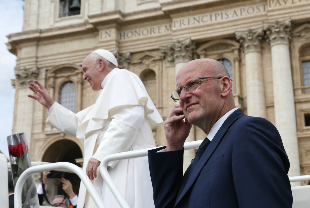 Domenico Giani, lead bodyguard for Pope Francis and head of the Vatican police force, keeps watch as the pope leaves his general audience in St. Peter's Square at the Vatican May 1. Pope Francis accepted Giani's resignation Oct. 14. (CNS/Paul Haring) Domenico Giani, lead bodyguard for Pope Francis and head of the Vatican police force, keeps watch as the pope leaves his general audience in St. Peter's Square at the Vatican May 1. Pope Francis accepted Giani's resignation Oct. 14. (CNS/Paul Haring)
