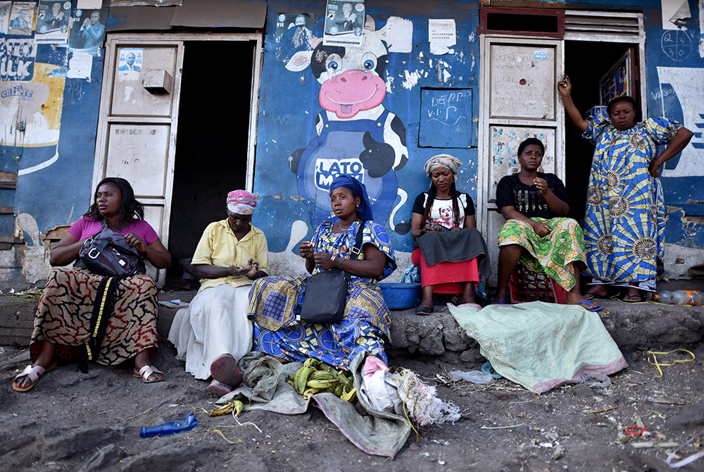 Women sit outside a dwelling amid concerns about the spread of the coronavirus disease March 23, 2020, in Goma, Congo. (CNS/Olivia Acland, Reuters) Women sit outside a dwelling amid concerns about the spread of the coronavirus disease March 23, 2020, in Goma, Congo. (CNS/Olivia Acland, Reuters)