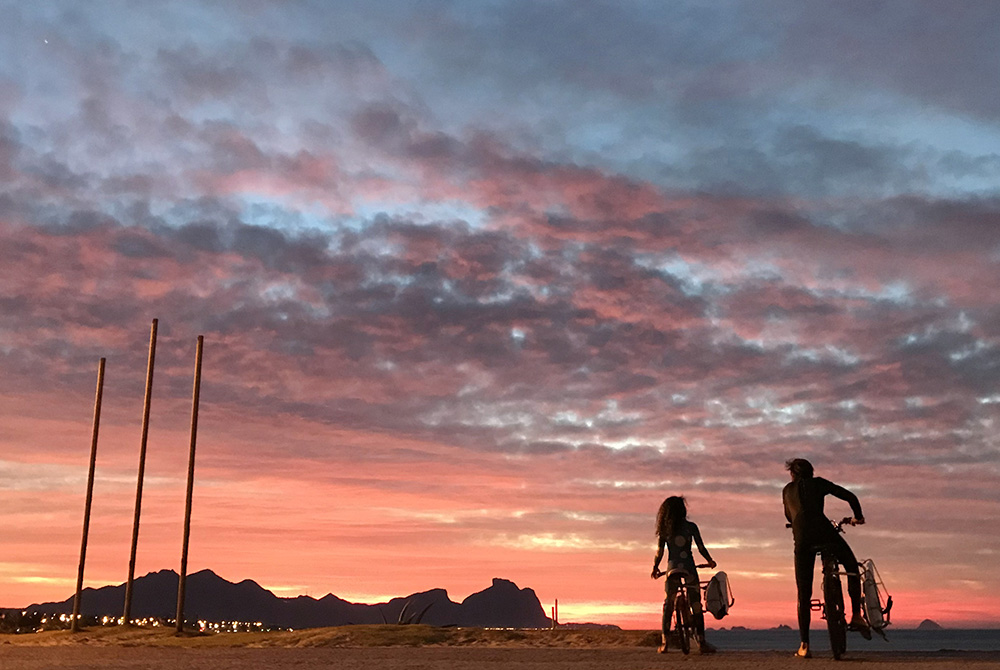 Sunrise along a beach July 1, 2020, in Rio de Janeiro A father and his daughter are seen during a sunrise along a beach July 1, 2020, in Rio de Janeiro. Brazil is struggling to deal with the needs of more than 130,000 children who have been made orphans amid the COVID-19 pandemic. (CNS/Reuters/Sergio Morae
