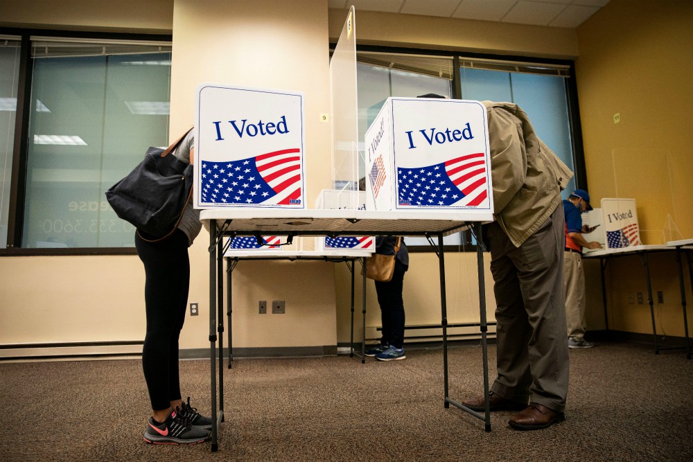 People fill out their ballots at an early voting site in Arlington, Virginia, Sept. 18. (CNS/Reuters/Al Drago) People fill out their ballots at an early voting site in Arlington, Virginia, Sept. 18. (CNS/Reuters/Al Drago)