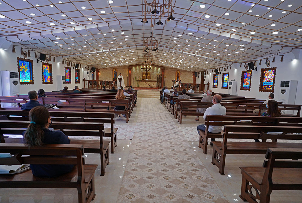People maintain social distancing while attending Mass at a church in Mosul, Iraq, Nov. 1, 2020, during the COVID-19 pandemic. Pope Francis plans to visit Iraq March 5-8, 2021. (CNS/Reuters/Abdullah Rashid) People maintain social distancing while attending Mass at a church in Mosul, Iraq, Nov. 1, 2020, during the COVID-19 pandemic. Pope Francis plans to visit Iraq March 5-8, 2021. (CNS/Reuters/Abdullah Rashid)