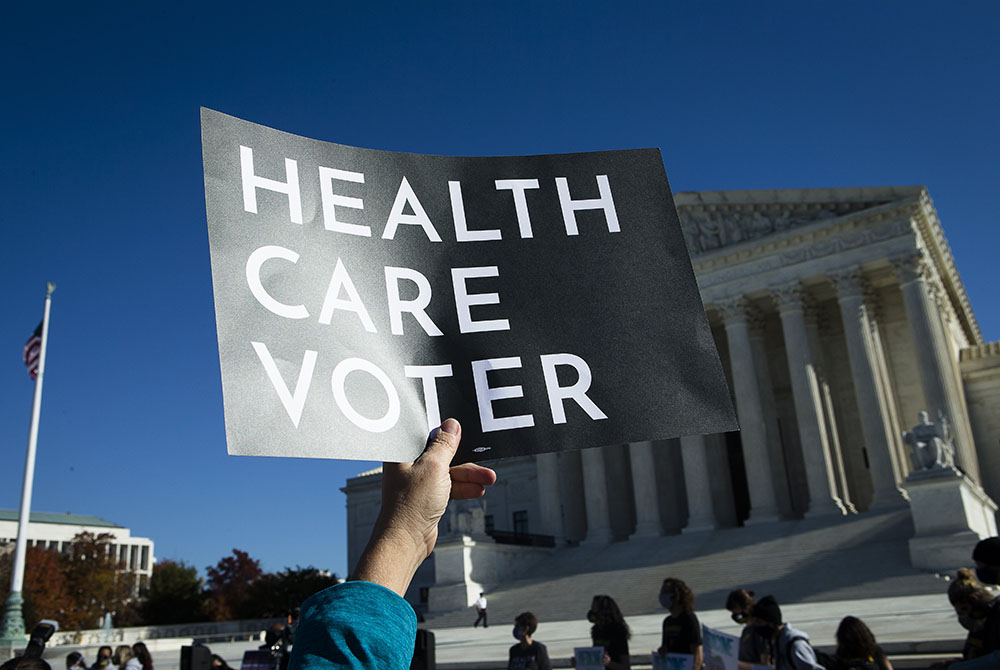 People demonstrate in support of the Affordable Care Act outside the U.S. Supreme Court Nov. 10 in Washington. (CNS/Tyler Orsburn) People demonstrate in support of the Affordable Care Act outside the U.S. Supreme Court Nov. 10 in Washington. (CNS/Tyler Orsburn)