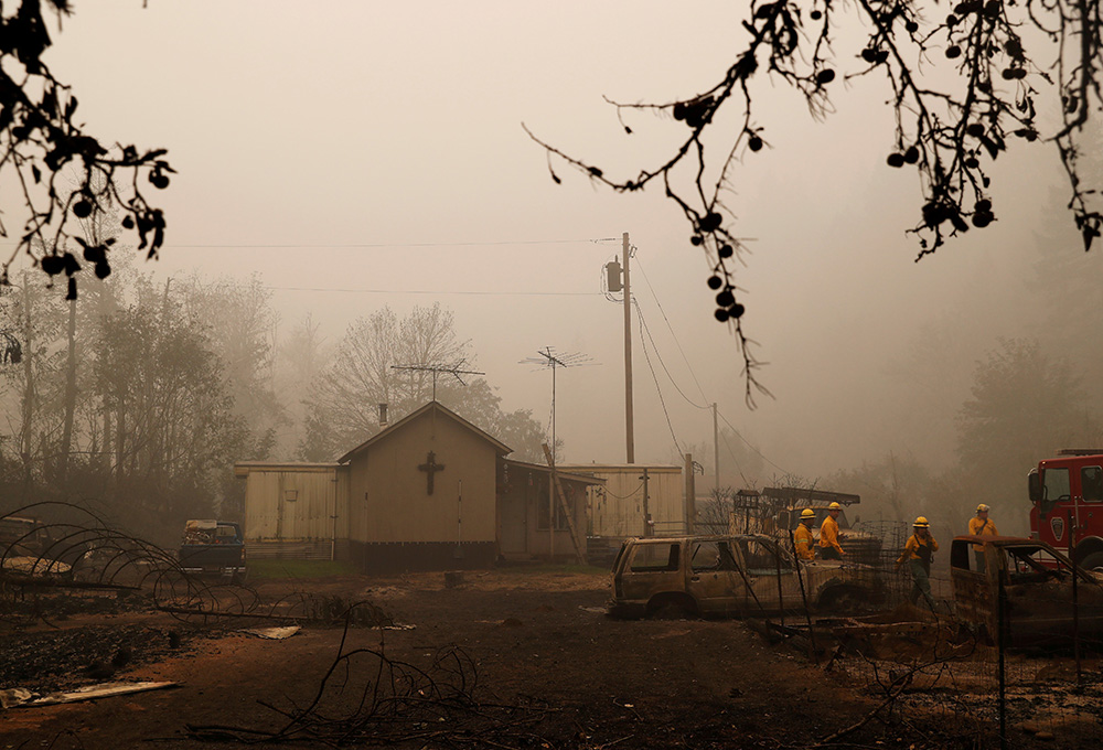 Firefighters in Detroit, Oregon, assess wildfire damage to a church Sept. 14, 2020, in the aftermath of the Beachie Creek Fire. (CNS/Reuters/Shannon Stapleton) Firefighters in Detroit, Oregon, assess wildfire damage to a church Sept. 14, 2020, in the aftermath of the Beachie Creek Fire. (CNS/Reuters/Shannon Stapleton)