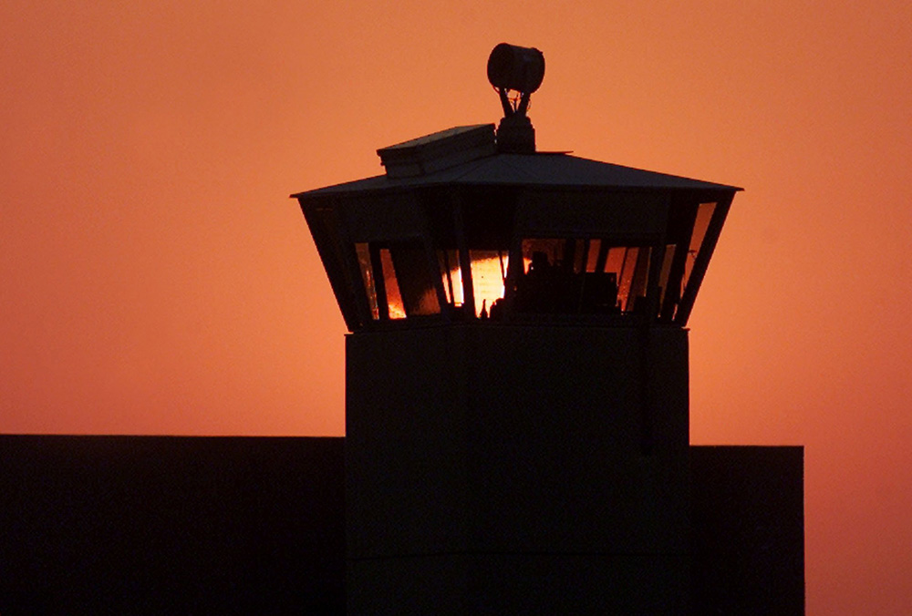 The sun sets behind one of the guard towers in a 2001 file photo at the Federal Correctional Complex in Terre Haute, Indiana, the site where the federal death penalty is carried out. (CNS/Reuters/Andy Clark) The sun sets behind one of the guard towers in a 2001 file photo at the Federal Correctional Complex in Terre Haute, Indiana, the site where the federal death penalty is carried out. (CNS/Reuters/Andy Clark)