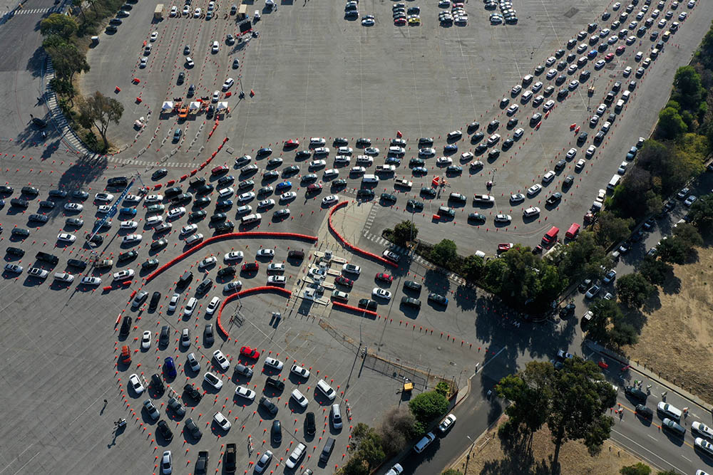 People in Los Angeles line up in their vehicles at Dodger Stadium for the COVID-19 test Jan. 4. (CNS/Reuters/Lucy Nicholson) People in Los Angeles line up in their vehicles at Dodger Stadium for the COVID-19 test Jan. 4. (CNS/Reuters/Lucy Nicholson)