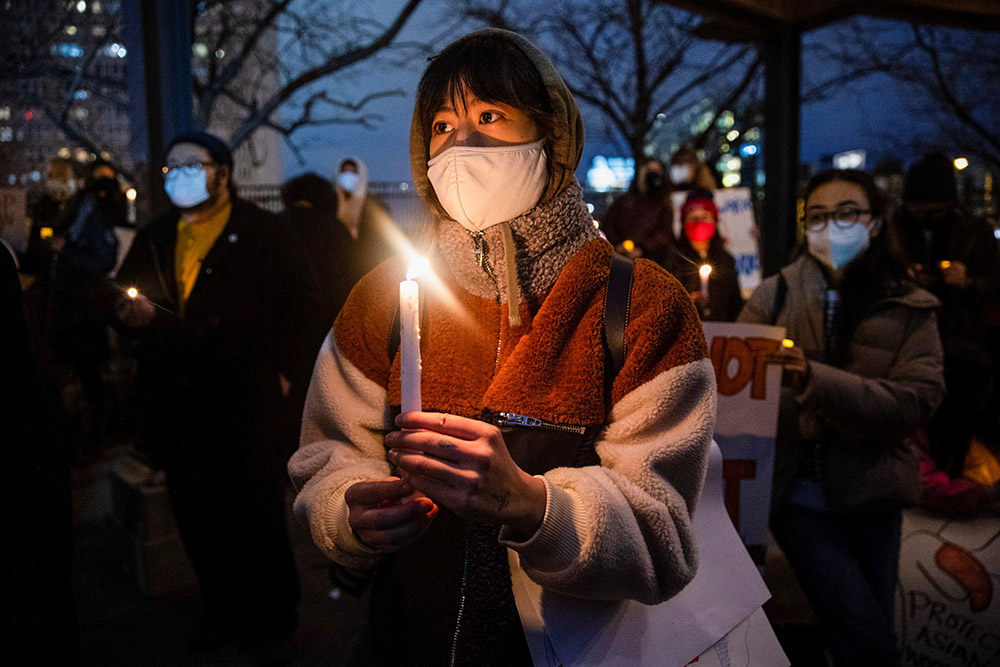People in Philadelphia attend a vigil in solidarity with the Asian American community March 17. (CNS/Reuters/Rachel Wisniewski) People in Philadelphia attend a vigil in solidarity with the Asian American community March 17. (CNS/Reuters/Rachel Wisniewski)