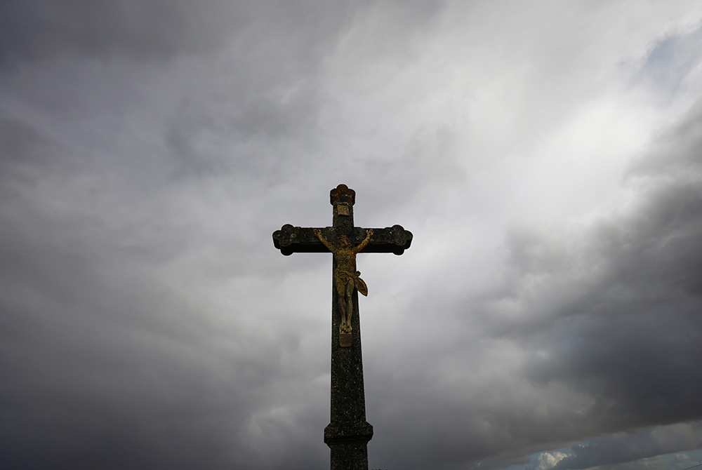 A cross is silhouetted outside a Catholic church Oct. 5 near Nantes, France. (CNS/Reuters/Stephane Mahe) A cross is silhouetted outside a Catholic church Oct. 5 near Nantes, France. (CNS/Reuters/Stephane Mahe)