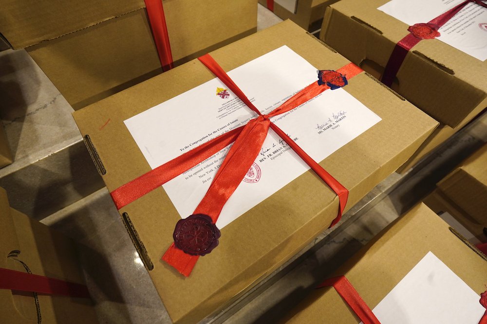 Sealed archival boxes containing documents related to Dorothy Day's canonization cause are seen in the sanctuary following a Mass Dec. 8, at St. Patrick's Cathedral in New York City. (CNS/Gregory A. Shemitz) Sealed archival boxes containing documents related to Dorothy Day's canonization cause are seen in the sanctuary following a Mass Dec. 8, at St. Patrick's Cathedral in New York City. (CNS/Gregory A. Shemitz)