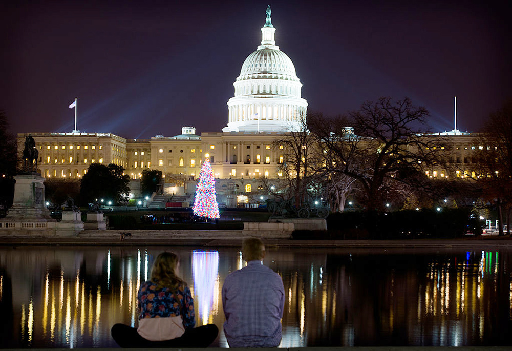 The lit 2012 U.S. Capitol Christmas Tree, from the Blanco Ranger District of the White River National Forest near Meeker, Colorado, decorated with handmade ornaments, draws visitors to the Capitol grounds, shortly after being turned on, Dec. 4, 2012. (Wikimedia Commons/U.S. Department of Agriculture, CC BY 2.0)