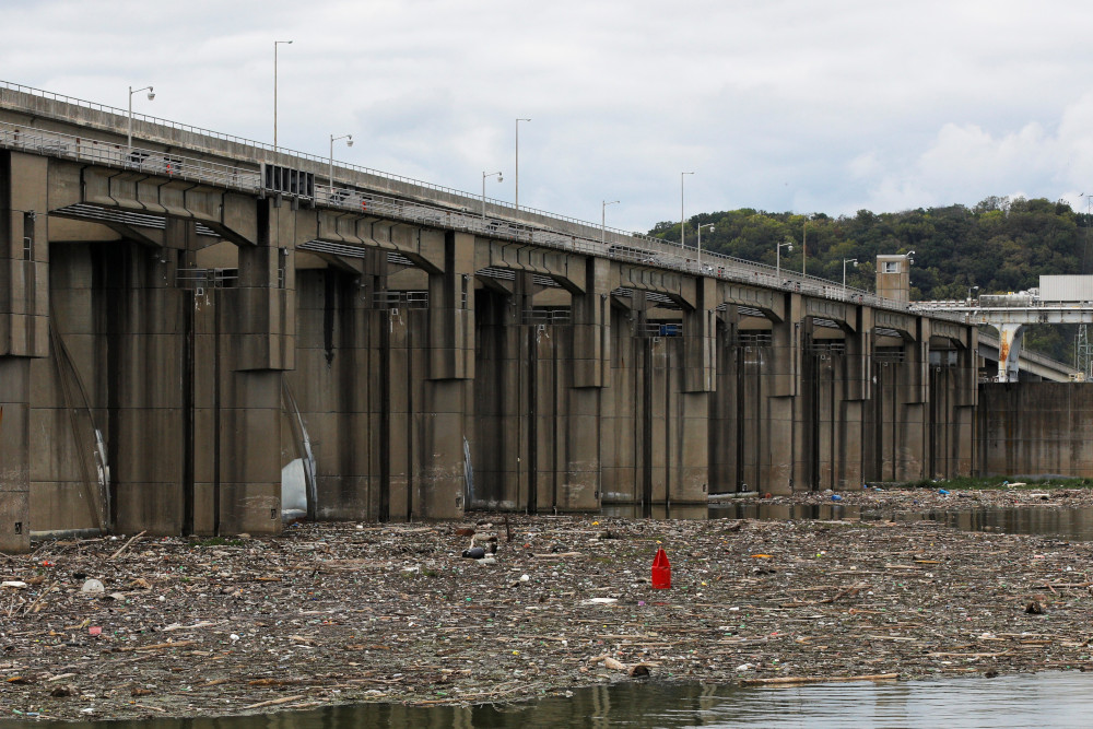 Garbage and debris pile up behind the Markland Locks and Dam on the Ohio River in Florence, Ind., Sept. 14, 2017. (CNS/Reuters/Brian Snyder)
