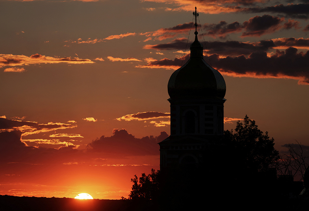 A church is seen at sunset July 12 in Kharkiv, Ukraine, during the Russian invasion. (CNS/Reuters/Nacho Doce) A church is seen at sunset July 12 in Kharkiv, Ukraine, during the Russian invasion. (CNS/Reuters/Nacho Doce)