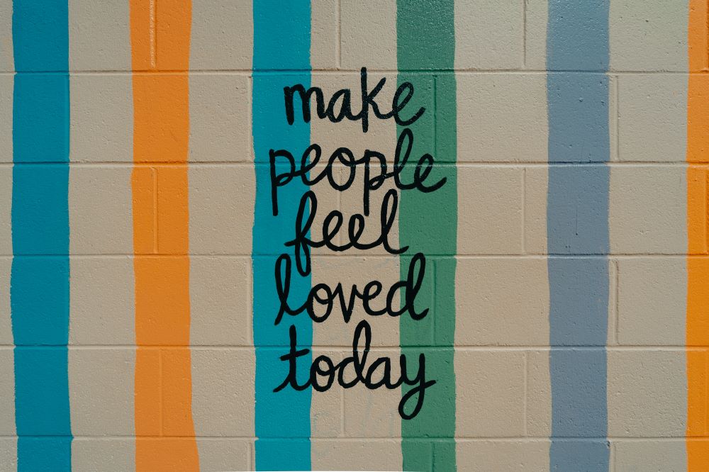 Written on a wall: Make people feel loved today