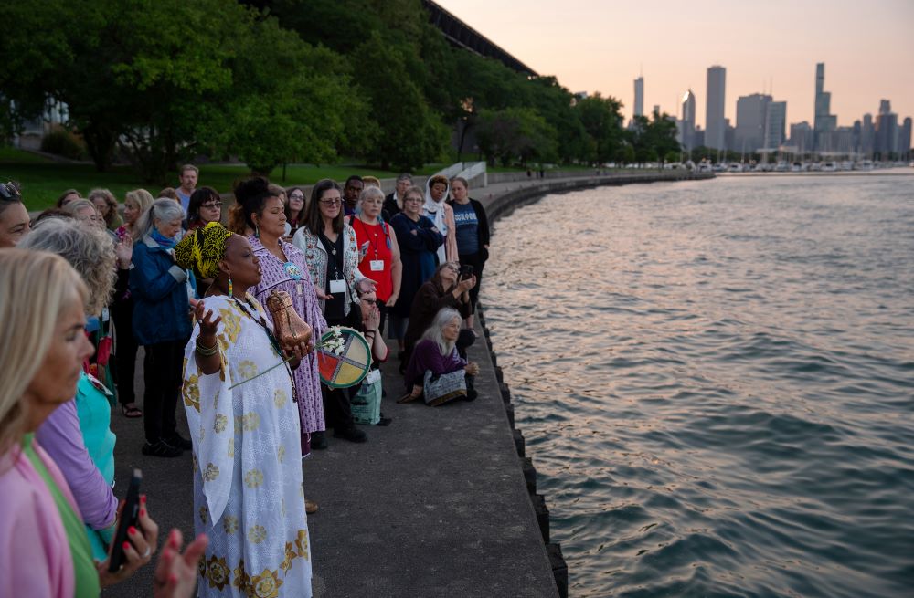 Yoruba priestess Aina-Nia leads a water ceremony by Lake Michigan as part of the Parliament of the World’s Religions in Chicago on Aug. 15, 2023.