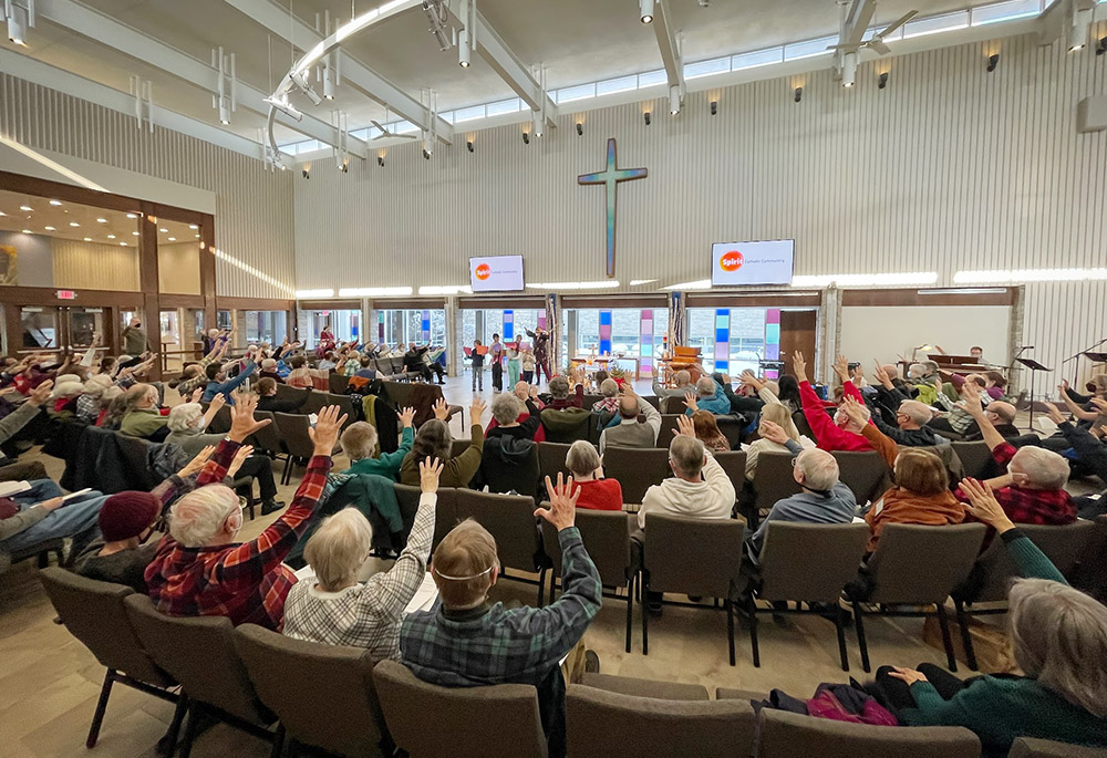 Spirit Catholic Community in Minneapolis blesses children and families baptized on Epiphany in 2023. (Peter Molenda)