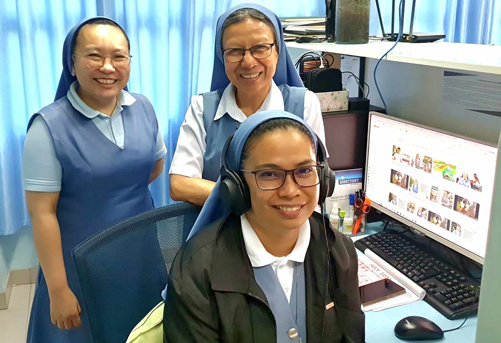 Pauline Sr. Pinky B. Barrientos (standing on right) with Sr. Parichat Jullamonthon (standing on left) and Sr. Josephine Tablante (seated in front). Jullamonthon and Tablante are in charge of the congregation's media production studio at the provincial house and communication center building. The provincial house and communication center building is located across the street opposite the central house. (GSR photo/Oliver Samson)