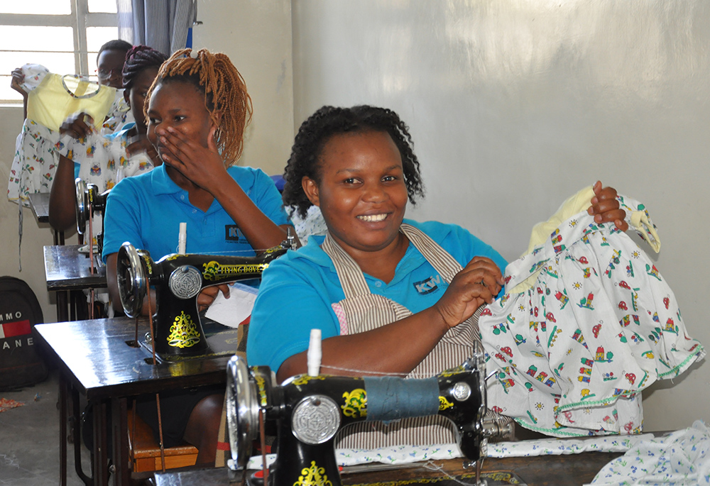 A student displays her work at the Kariobangi Women Promotion Training Institute. The school provides free materials because most students come from poor backgrounds and are not able to buy the materials if asked. (Lourine Oluoch)