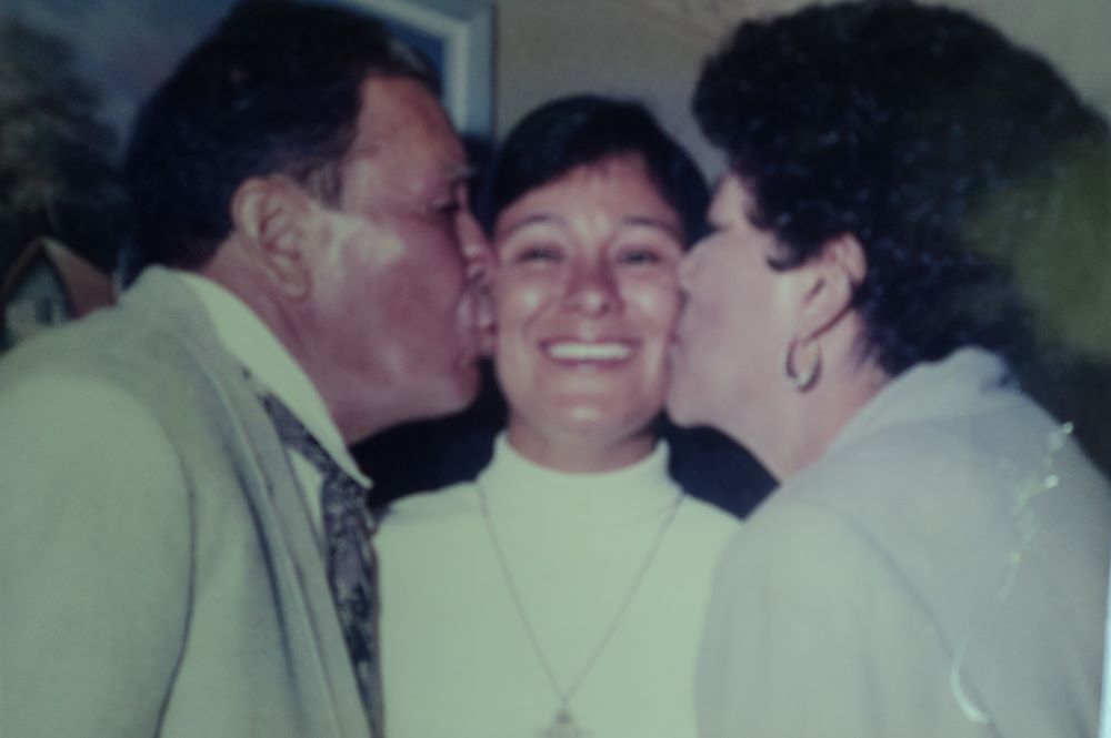 The author, shown with her parents, made her perpetual profession in San Fernando, California, on Aug. 3, 1996. (Courtesy of Maria Elena Mendez Ochoa)