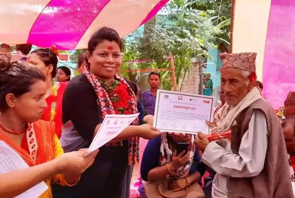 Sr. Durga Cecilia Shrestha (center), a member of the Sisters of St. Joseph of Cluny and the first woman executive director of Caritas Nepal seen at a program with beneficiaries. (Courtesy photo)