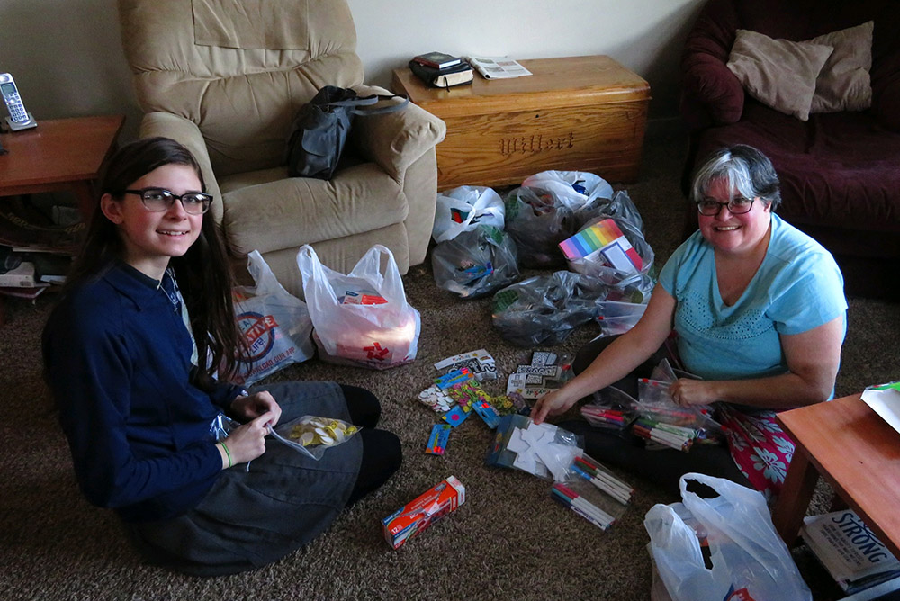 Mercy Sr. Jennifer Wilson and Hope Willert, her student, prepare materials for a service trip to Guayana in March 2017. (Courtesy of Jennifer Wilson) 