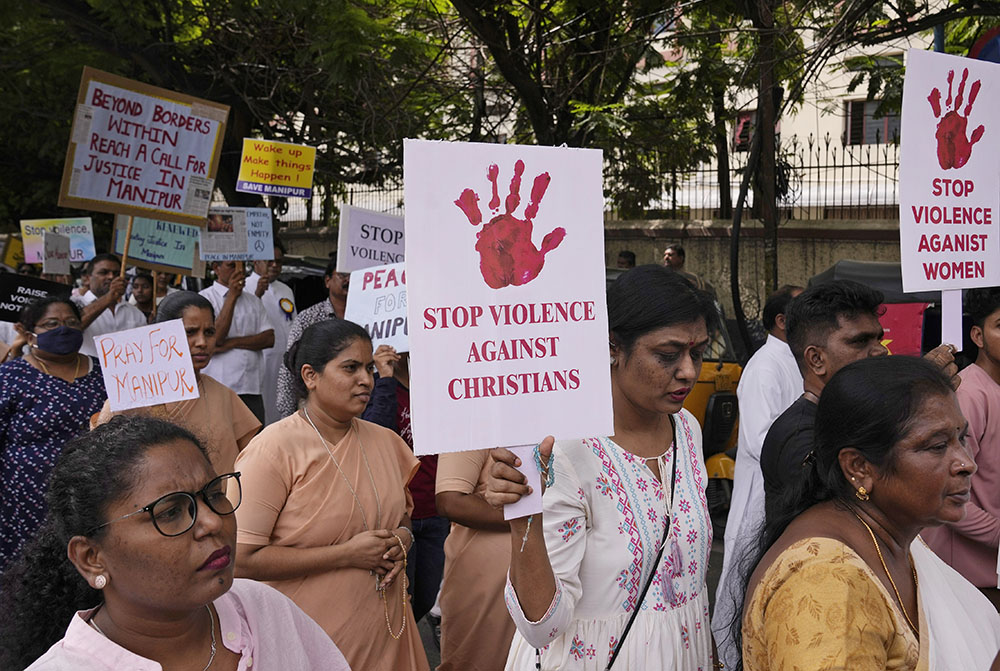 Catholic Christians hold placards and participate in a peace rally against violence in the northeastern Manipur state, in Hyderabad, India, Aug. 25, 2023. (AP/Mahesh Kumar A.)