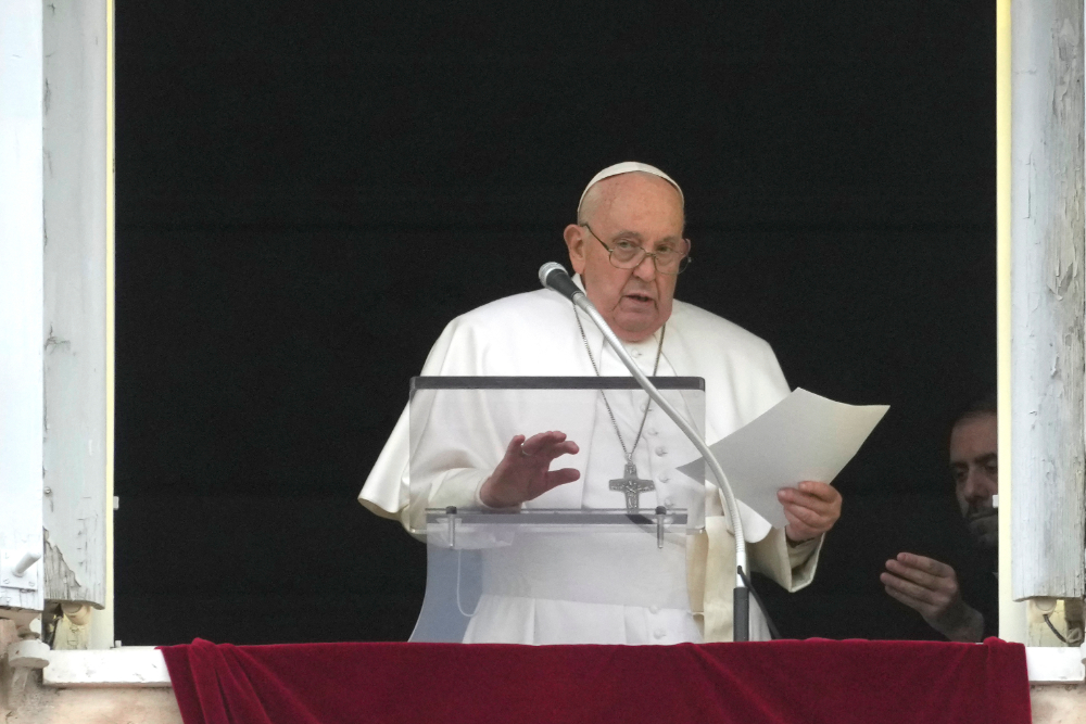 Pope reads Angelus message Pope Francis reads his message during the Angelus noon prayer from the window of his studio overlooking St. Peter's Square, at the Vatican, Sunday, March 10, 2024.
