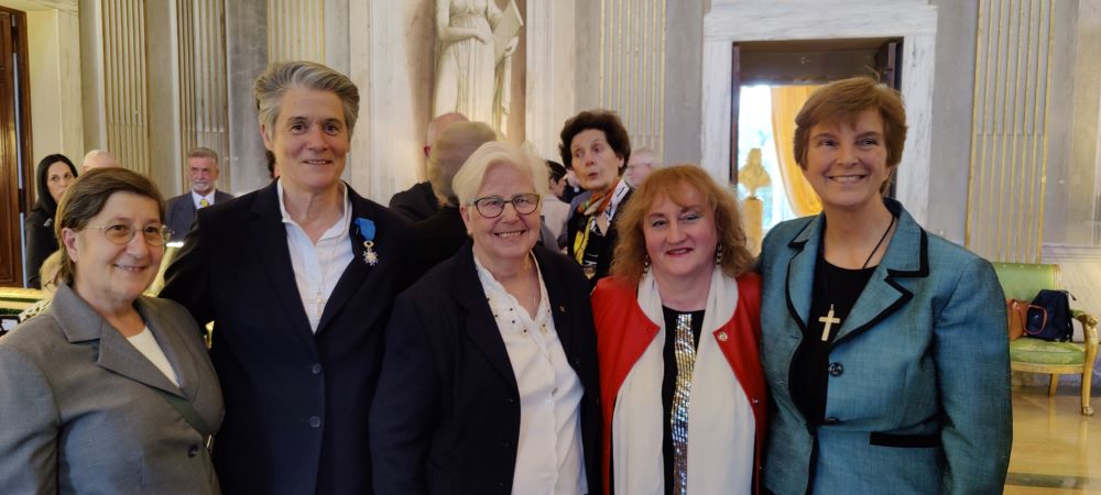 Sacred Heart Sr. Florence de la Villeon (second from left), technical coordinator for the International Union of Superiors General, on April 3 was presented with the French National Order of Merit in honor of her decades of religious and humanitarian witness.