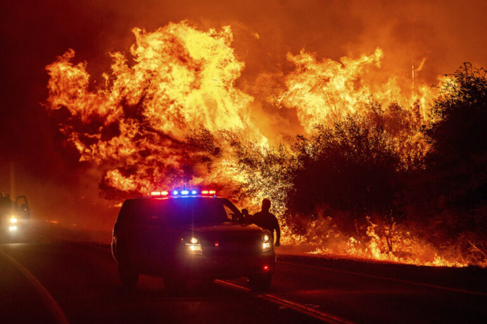 Latinos play pivotal role in environmental activism Towering conflagration pierces night sky, emergency vehicle seen in foreground