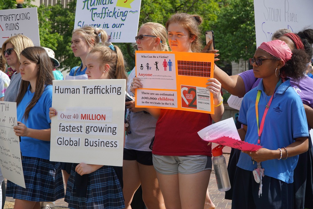 Human trafficking bills 2024 Young people demonstrate with signs in favor of combating human trafficking