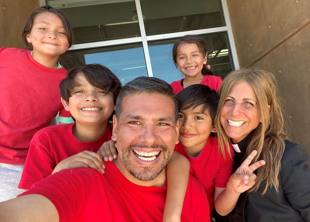 Father Anne (Anne Tropeano), right, poses with Javier Benavidez and his family. Father Anne (Anne Tropeano), right, poses with Javier Benavidez and his family.
