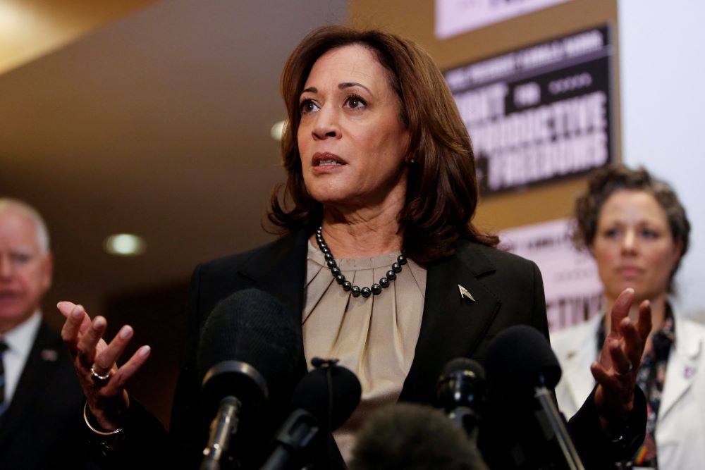 Minnesota Gov. Tim Walz and Dr. Sarah Traxler look on as U.S. Vice President Kamala Harris speaks as she visits an abortion clinic in Minneapolis March 14. Minnesota Gov. Tim Walz and Dr. Sarah Traxler look on as U.S. Vice President Kamala Harris speaks as she visits an abortion clinic in Minneapolis March 14.