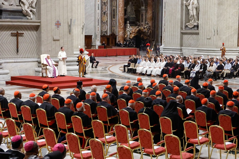 Pre-Synodal penitential liturgy, Oct. 1, 2024, Rome. Pope seated on red dais; to his left is a group of young people, and to his right facing straight ahead are rows of prelates.