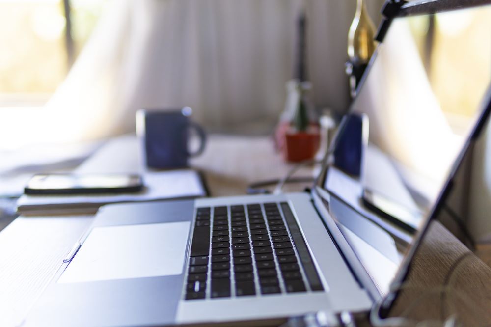 laptop open on a table Laptop open on a table