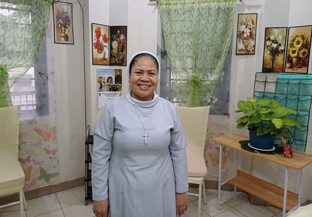 Sr. Angelina Julom stands at the Nazareth Psycho-Social Wellness Center for Individuals and Families in Cainta, Rizal, Philippines. Sr. Angelina Julom stands at the Nazareth Psycho-Social Wellness Center for Individuals and Families in Cainta, Rizal, Philippines.