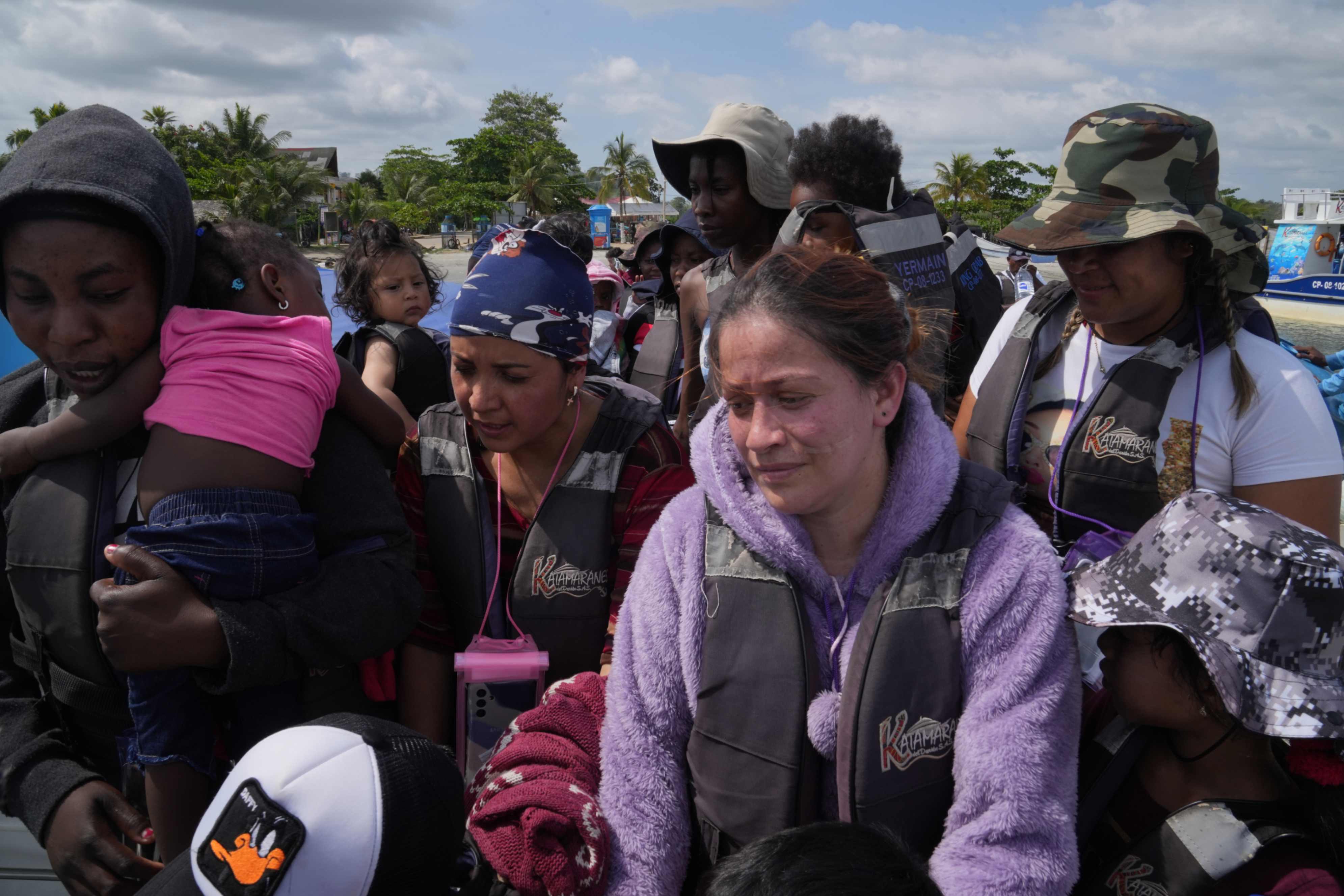 Migrant women from Venezuela and Haiti prepare to embark in Necoclí, Colombia, on April 28. (GSR/Manuel Rueda)