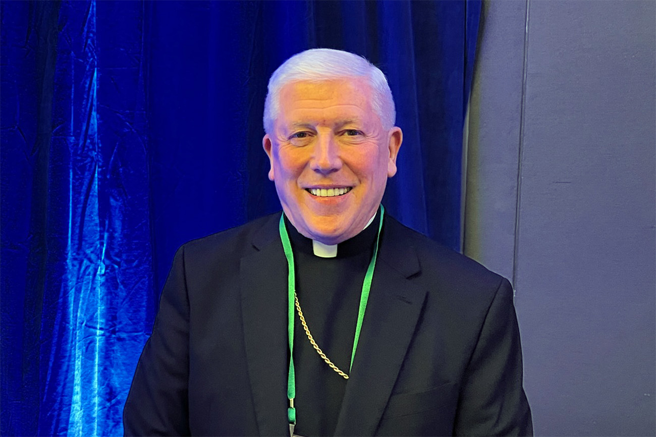 Bishop Daniel Thomas of Toledo, Ohio; USCB Pro-Life Committee Chair, Baltimore, 2024. The bishop wears plain black clerics and smiles against a blue backdrop.
