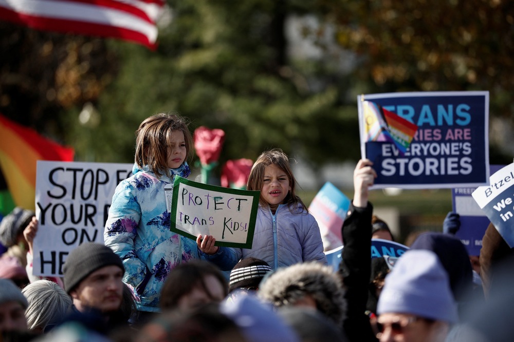 Demonstrators outside U.S Supreme Court, United States v. Skrmetti, Dec. 2. 2024, Washington. D.C. People holding signs.