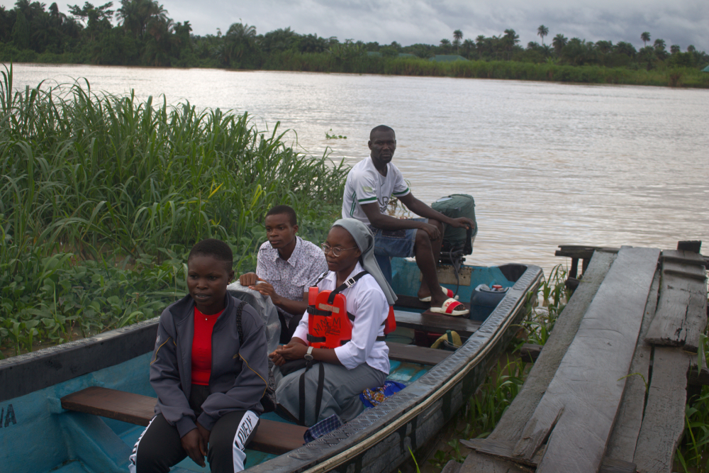 Sr. Janefrances Ihekuna and her team on a boat Sr. Janefrances Ihekuna and her team on a boat